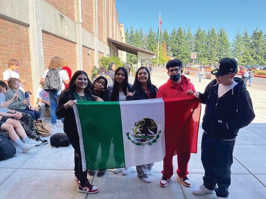 Students at Prairie High School from the Latino Student Union hold a Mexican flag to celebrate Hispanic Heritage Month.