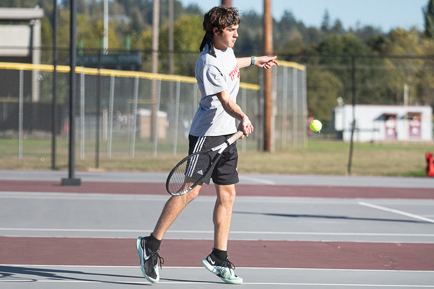 W.F. West tennis player Aaron Boggess returns a serve against Centralia Oct. 12.