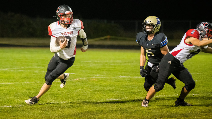 Toledo senior Austin Norris (3) keeps the football on a run during the Riverhawks' 18-0 win at Adna on Oct. 14.