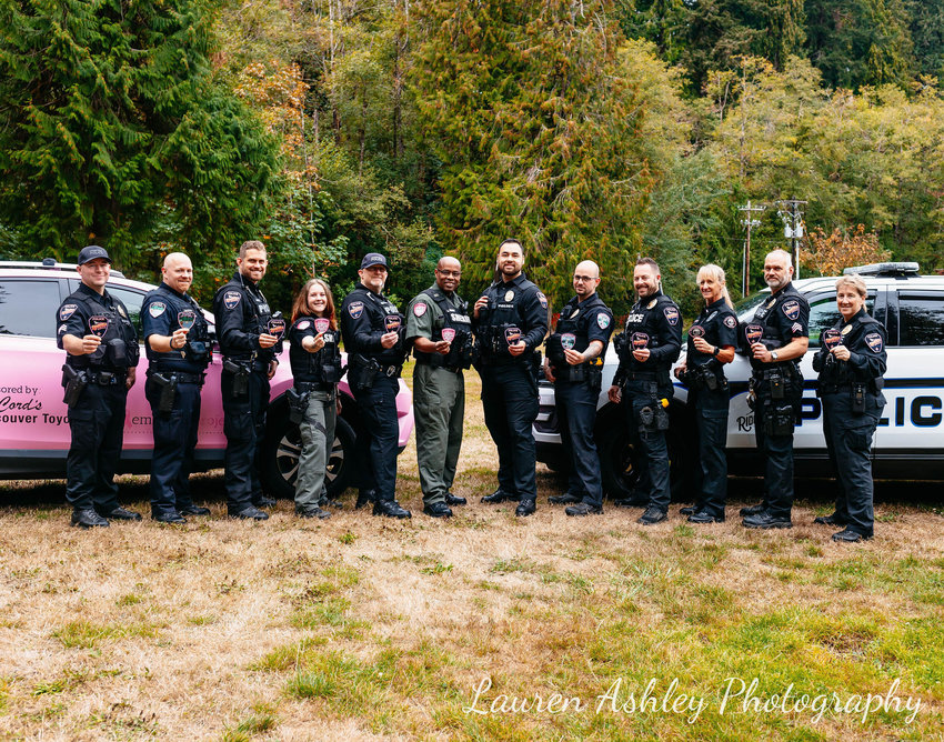 Officers with the Ridgefield Police Department sport pink patches in recognition of Breast Cancer Awareness Month.