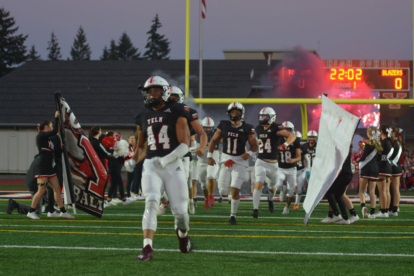 Junior Onyx Carter leads the Tornados onto the field on Thursday, Oct. 13 for the team&rsquo;s rivalry matchup against Timberline.