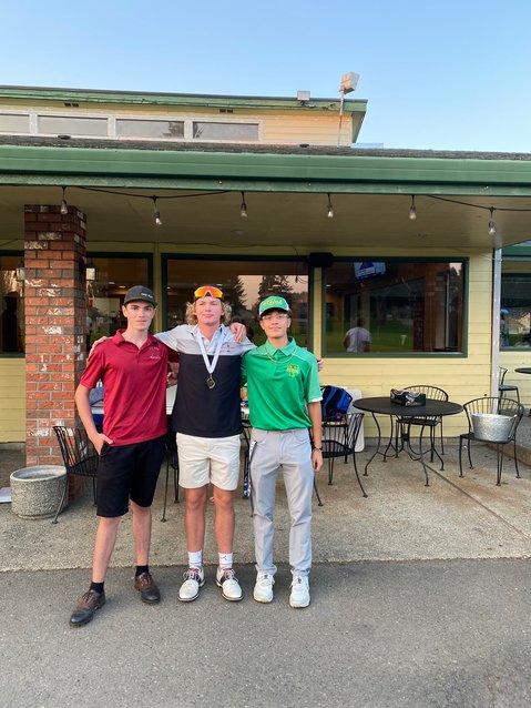 The top three finishers at the 2A Evergreen Conference Golf Championships pose for a photo in front of the Newaukum Valley Golf Course clubhouse Oct. 18. From left to right are second-place finisher Ben Halverstadt of W.F. West, first-place finisher Von Wasson of Centralia, and third-place finisher Kaden Clark of Tumwater.