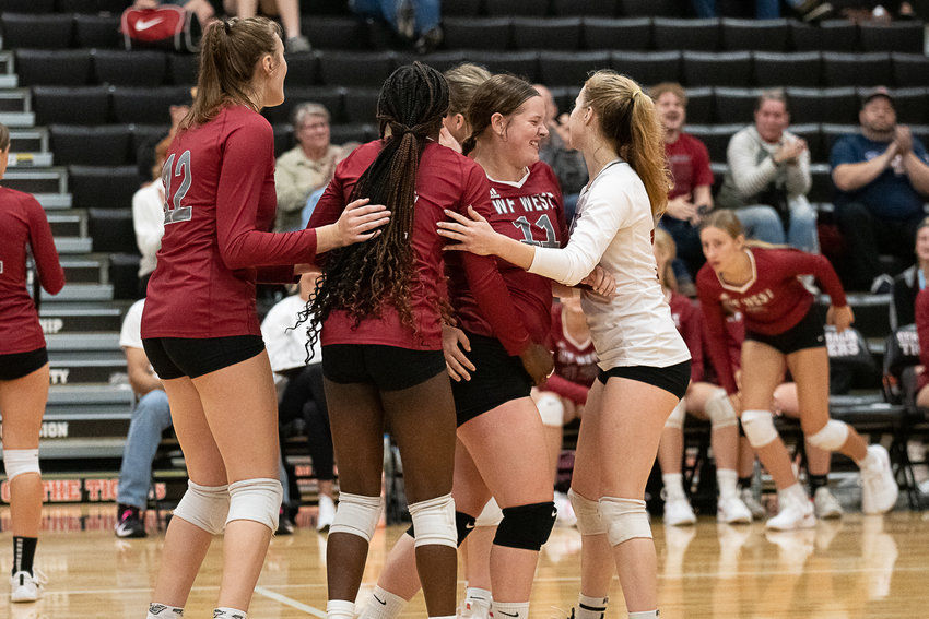 W.F. West's vollyball team celebrates after defeating Centralia in five sets at Ron Brown Court Oct. 18.