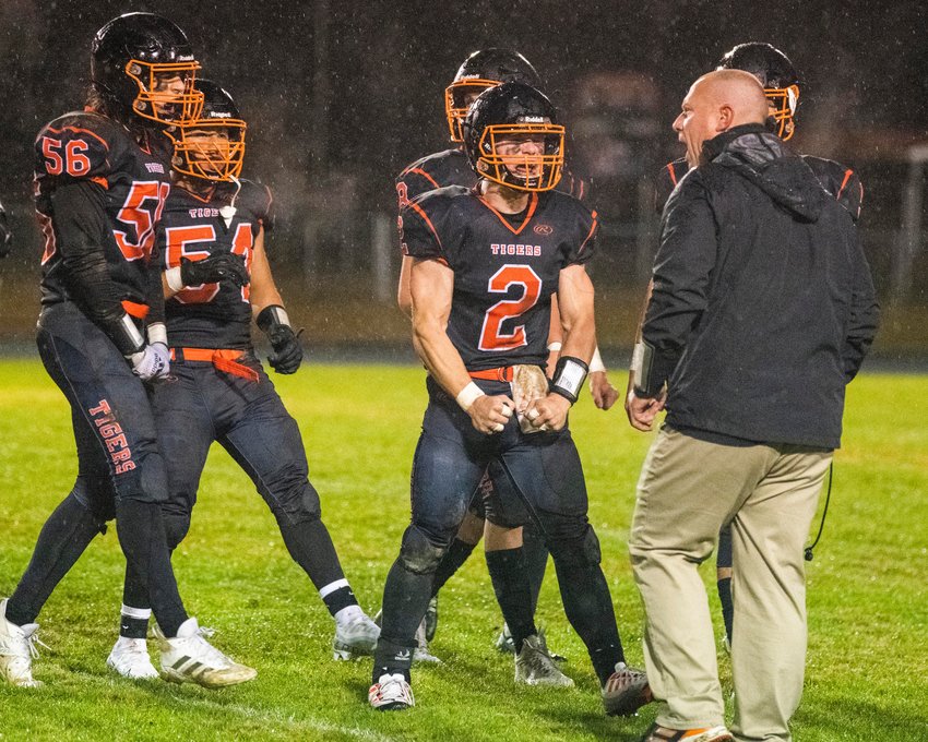 Napavine Head Coach Josh Fay gets pumped up with players Friday night during a league championship game.