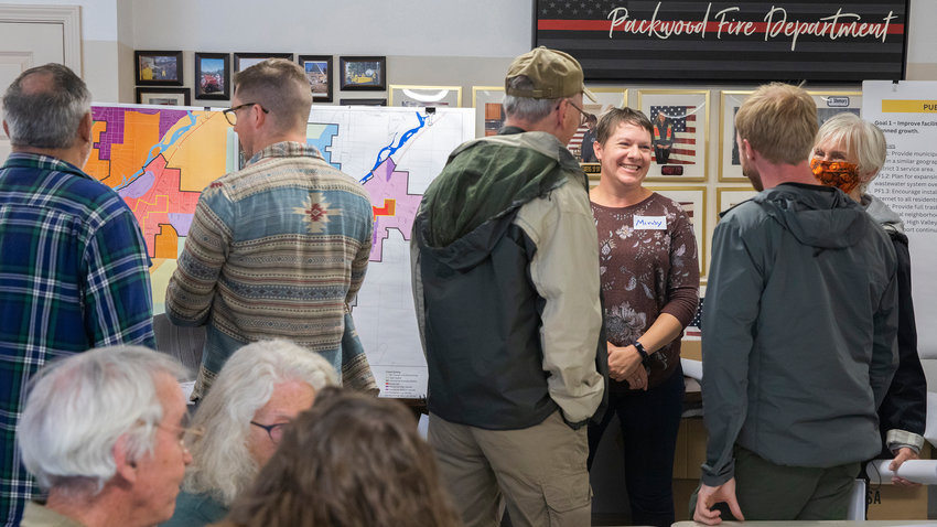 Lewis County Senior Long Range Planner Mindy Brooks smiles while talking with community members at the Packwood Fire Department about future zoning concepts on Saturday.