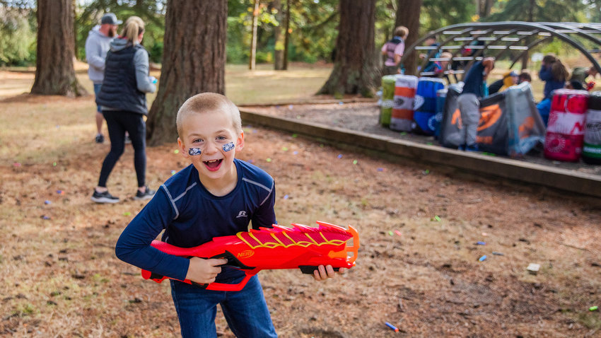 Stetson Sickles, 10, smiles while holding a toy blaster at a Nerf war hosted by Gemini Events at Borst Park in support of his brother Titus, 4, who has a terminal heart condition. Titus was unable to attend after falling ill and spending the night on oxygen at Seattle Children&rsquo;s Hospital. See more photos at chronline.com.