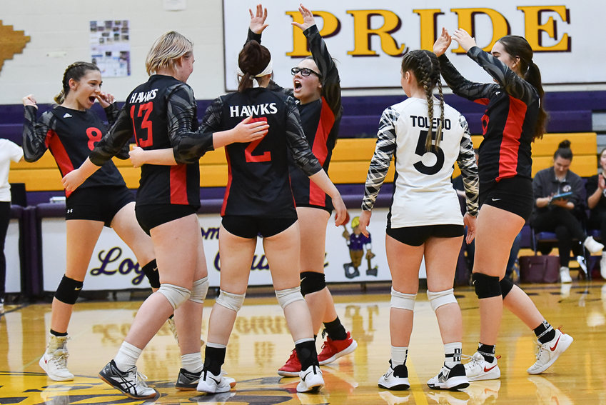 Toledo celebrates a point during the first set of its match at Onalaska on Oct. 26.