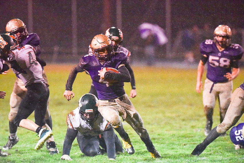 Onalaska's Kayden Mozingo bursts through the hole during the first half of the Loggers' 26-8 win over MWP on Nov. 4 in a district crossover.
