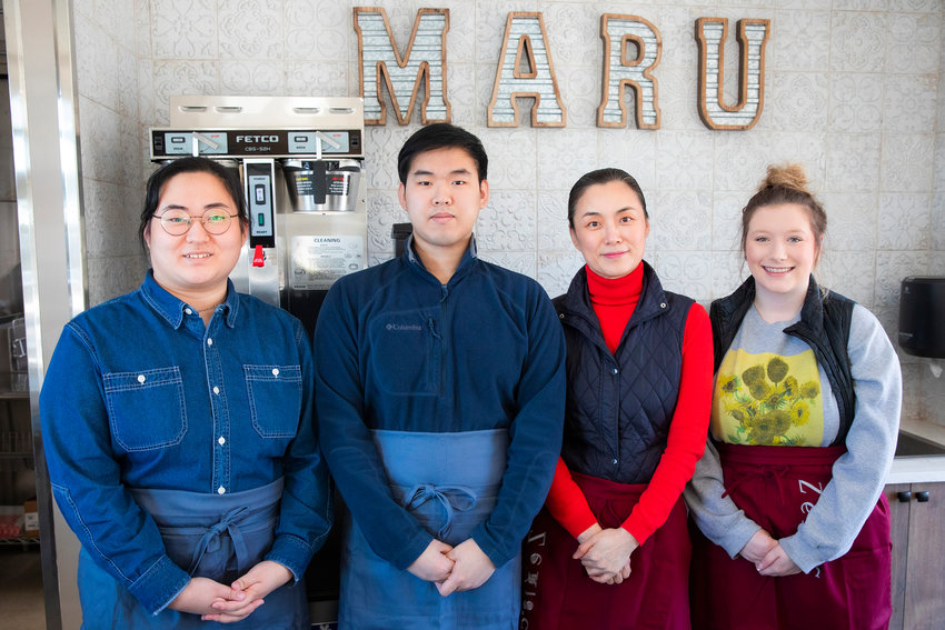 From left, Sage, Chan and Jenny Lee pose for a photo alongside barista Emily Combs Monday afternoon at Cafe Maru &amp; Deli in Chehalis.