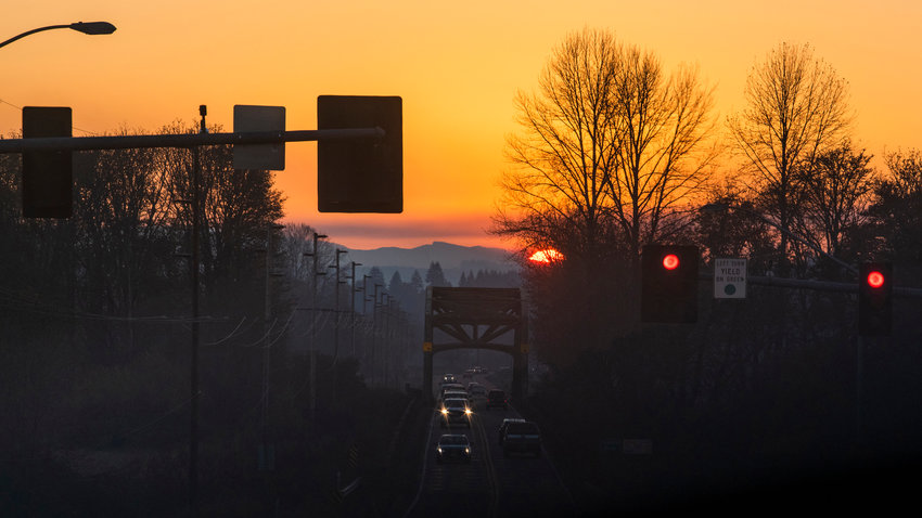 The sun sets over the Willapa Hills illuminating the sky in an orange hue as seen from Chehalis Tuesday evening.