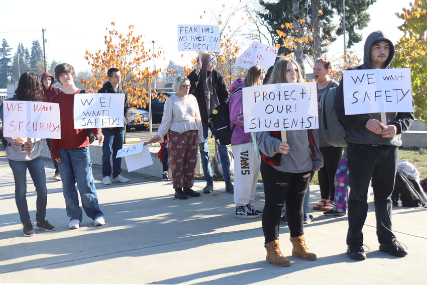 Centralia High School students protest outside the school building over safety and security concerns on Thursday. The protest was organized by senior Dante Higgens, front right, and sophomore Erron Paul, to Higgens&rsquo; left.