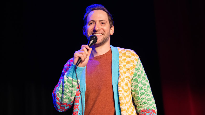 Samuel J. Comroe smiles while performing a sold out comedy show Friday night at the McFiler&rsquo;s Chehalis Theater during his &ldquo;Come Get These Giggles,&rdquo; tour across the United States.