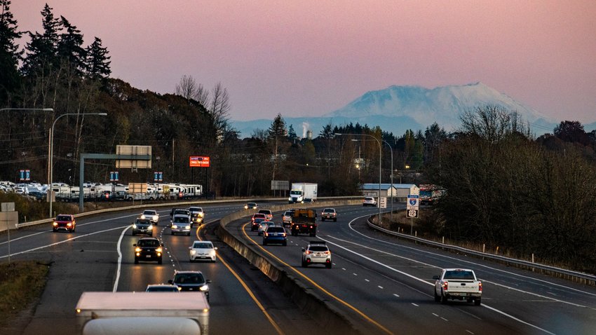 Mount St. Helens is seen at sunset beyond Interstate 5 from the SW 13th Street overpass in Chehalis Friday evening.