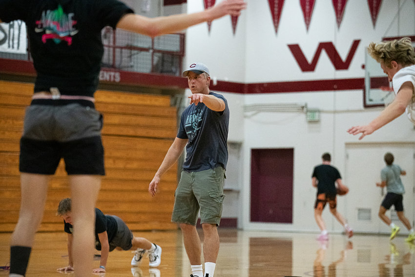 W.F. West head coach Chris White instructs his team during conditioning Nov. 22.