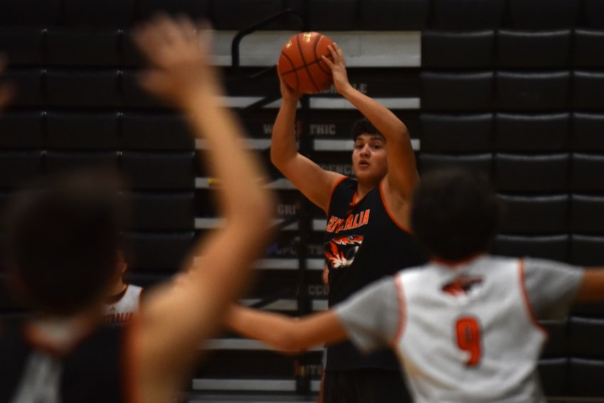 Centralia sophomore Carlos Vallejo looks to throw a pass down the court during the Tigers' Nov. 23 practice.