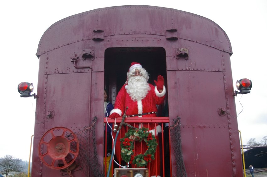 Santa waves from a train car at the Chehalis-Centralia Railroad and Museum in this photo provided by the organization.