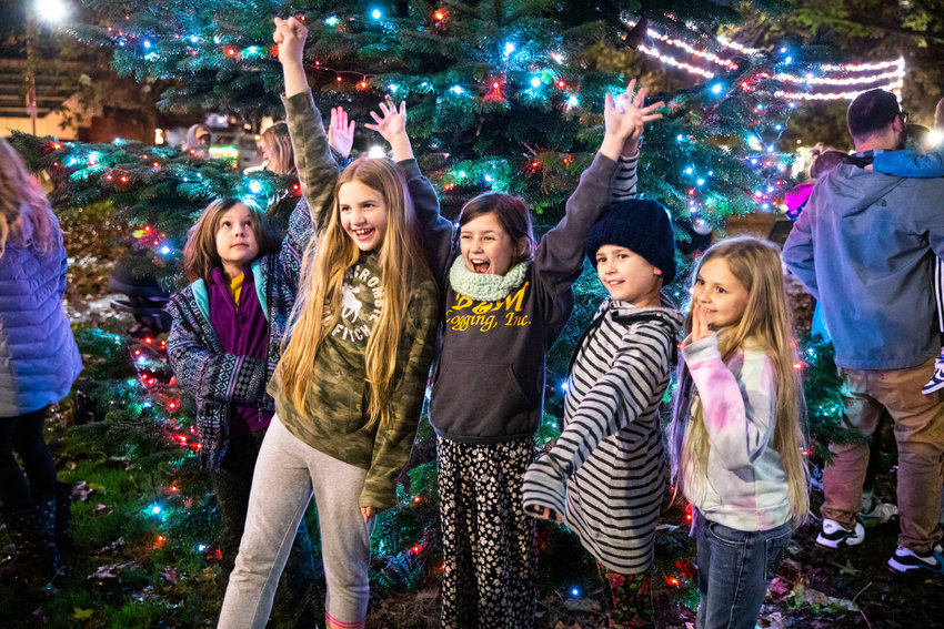 Members of the Phillips family from Centralia and Battle Ground smile for a photo at George Washington Park during a Christmas Tree Lighting celebration. The Centralia Downtown Association organized the event, which was revamped from past versions.