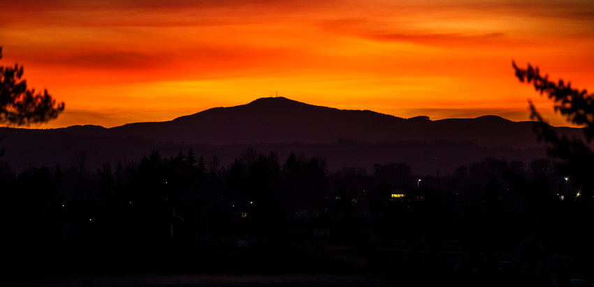 The sun sets over the Willapa Hills seen from Chehalis.