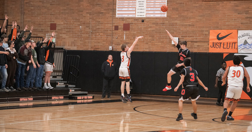 Centralia&rsquo;s Cohen Ballard (3) makes a 3-point shot during the Tigers' 66-57 loss to Oakville on Dec. 5.