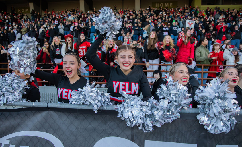 Yelm cheerleaders flash smiles of elation after the football team earned its first 3A State Championship title against Eastside Catholic on Dec. 3 in Puyallup&rsquo;s Sparks Stadium. A community celebration in honor of the football team is scheduled for Jan. 23.
