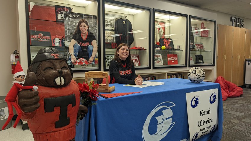 Tenino forward Kami Oliveira signs her letter of intent to play soccer at South Puget Sound Community College on Monday.