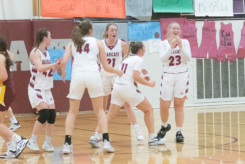 The W.F. West girls basketball team celebrates its 48-40 win over White River on Dec. 13.