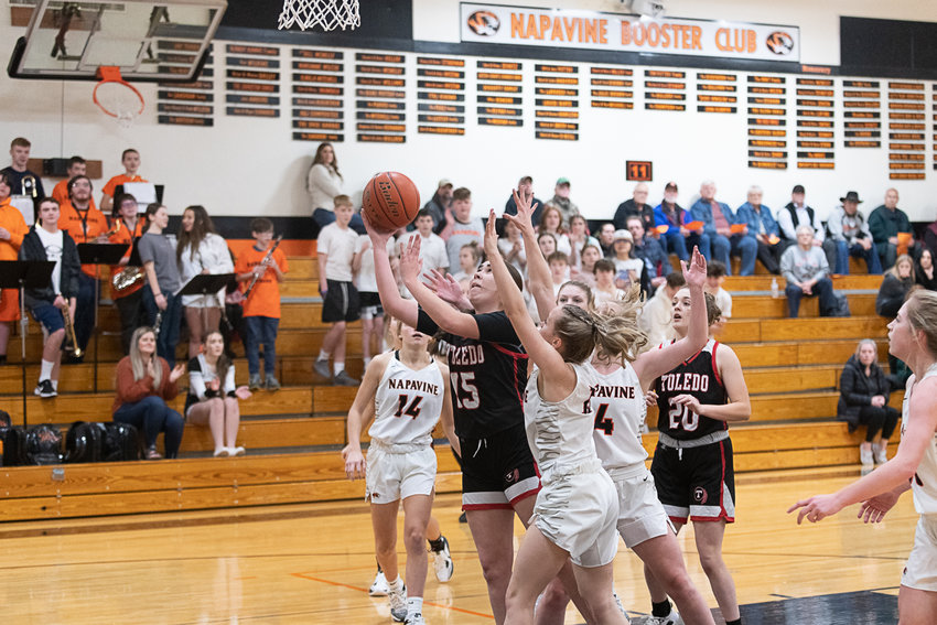Stefani Arceo-Hanson fights through defenders toward the hoop during the first half of Toledo's loss to Napavine on Dec. 14.
