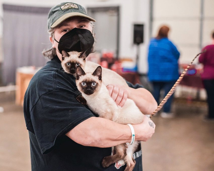 FILE PHOTO &mdash; Jeanette McLeese carries two kittens named Bob and Deziray through the Southwest Washington Fairgrounds in Centralia.