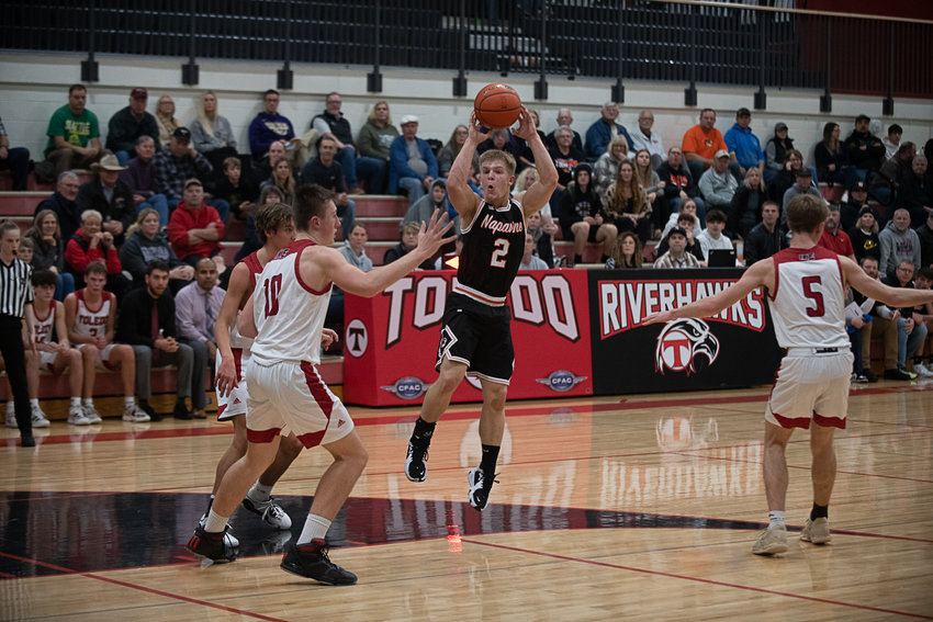 Napavine's Cael Stanley fires off an overhead pass to the corner during the second quarter of the Tigers' 59-47 win over Toledo on Dec. 15.