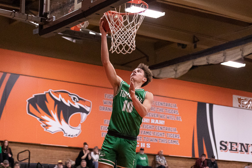 Tumwater guard Andrew Collins makes a fastbreak layup against Centralia Dec. 16.