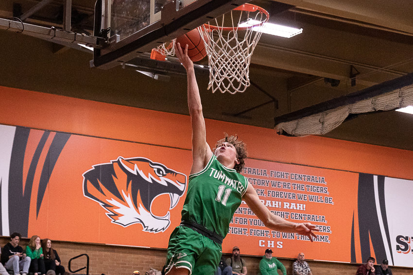 Tumwater guard Luke Brewer makes a layup in transition against Centralia Dec. 16.