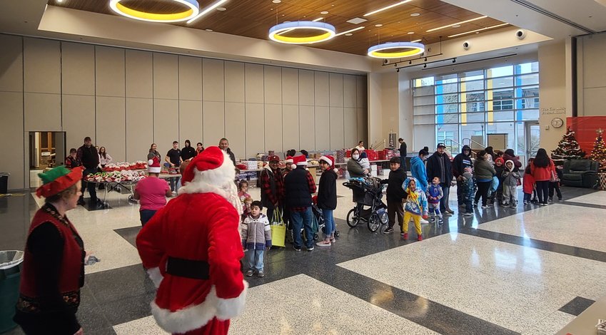 On Saturday at Centralia College, United Way of Lewis County hosted 270 kids for a gift giveaway, with each receiving a new toy and book from Santa Claus. &nbsp;