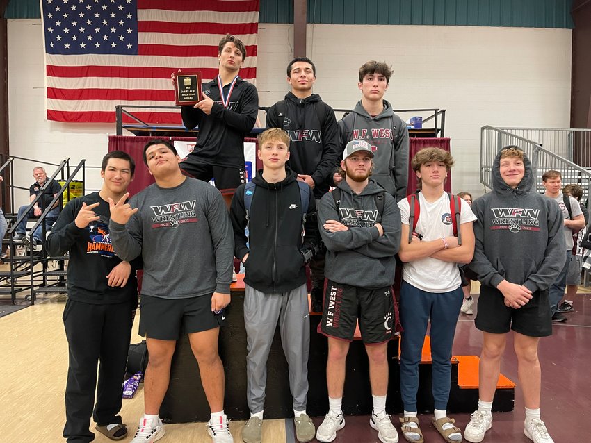The W.F. West wrestling team poses with the Hammerhead Invitational third-place trophy last weekend.
