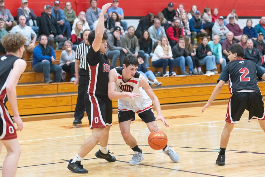 Tenino's Brody Noonan tries to work through contact in the paint during the second quarter of the Beavers' matchup against Ocosta on Dec. 21.