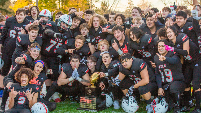 The Yelm High School football team celebrates after winning the 3A State Championship.