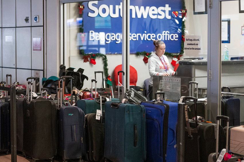 Unclaimed luggage piles up at the Southwest Airlines baggage service office in the Philadelphia International Airport.