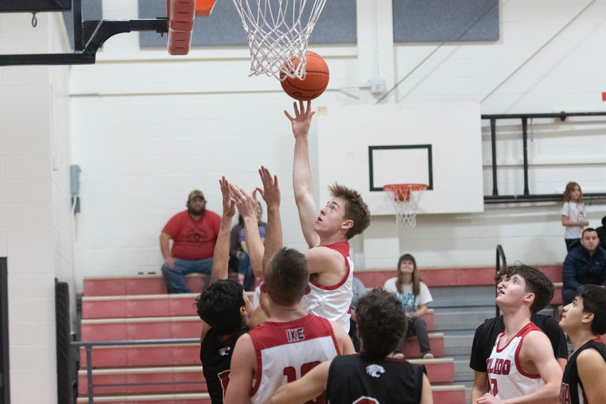 Conner Olmstead puts up a shot through traffic during the first quarter of Toledo's game against Ocosta on Dec. 28.