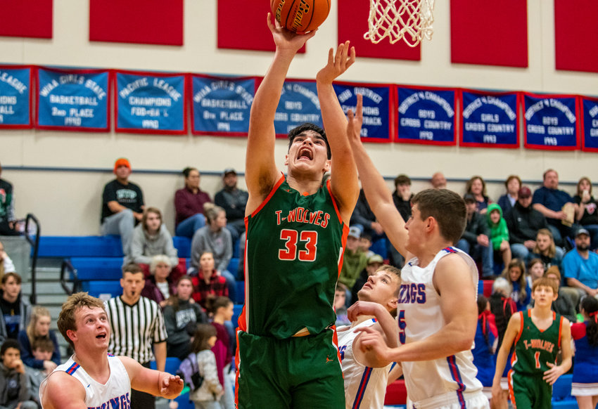 Morton-White Pass post Josh Salguero goes up for two points against Willapa Valley at the Jack Q. Pearson Holiday Classic in Menlo on Dec. 29.