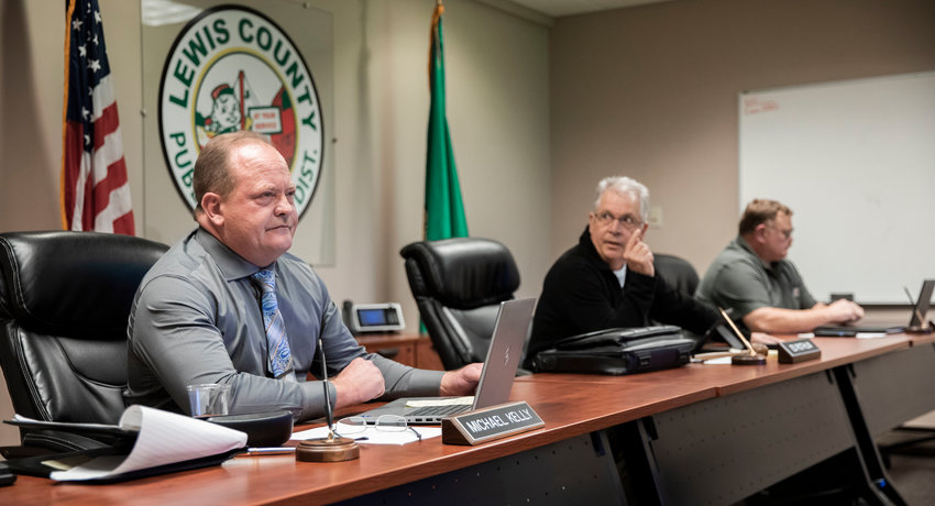 Commissioner Mike Kelly motions to approve David Plotz as general manager during a Lewis County Public Utility District meeting in Chehalis on Tuesday.