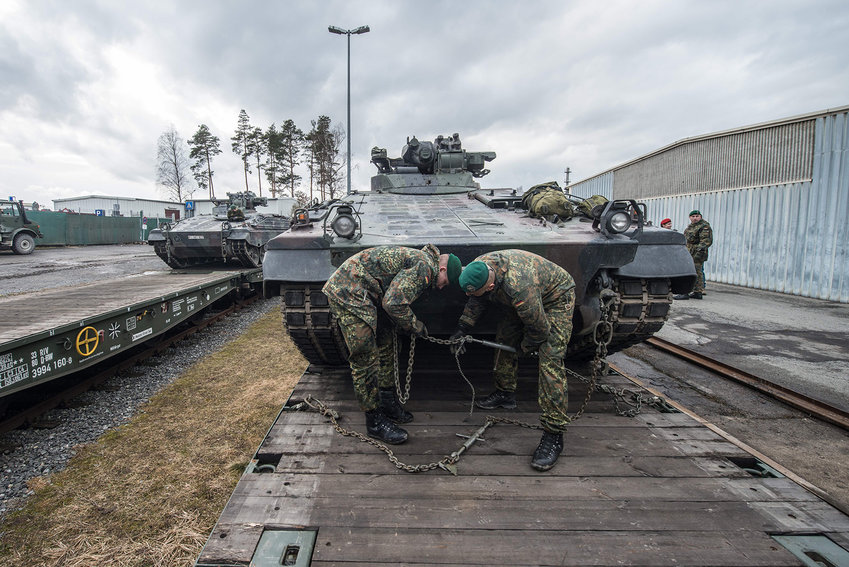 German soldiers load armored vehicles of the type &quot;Marder&quot; on a train at the troop exercise area in Grafenwoehr, southern Germany, on Feb. 21, 2017. (Armin Weigel/DPA/AFP via Getty Images/TNS)