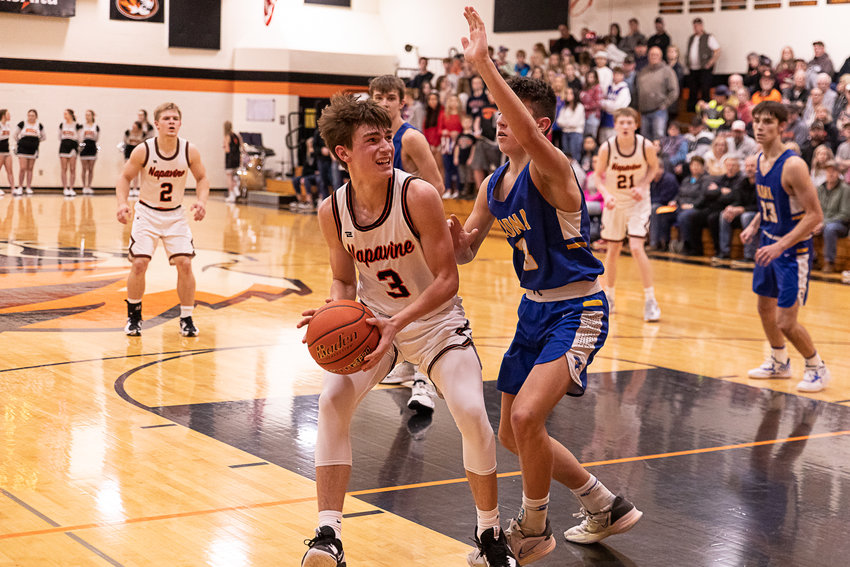 Napavine guard James Grose works in the post against Adna guard Braeden Salme Jan. 5.