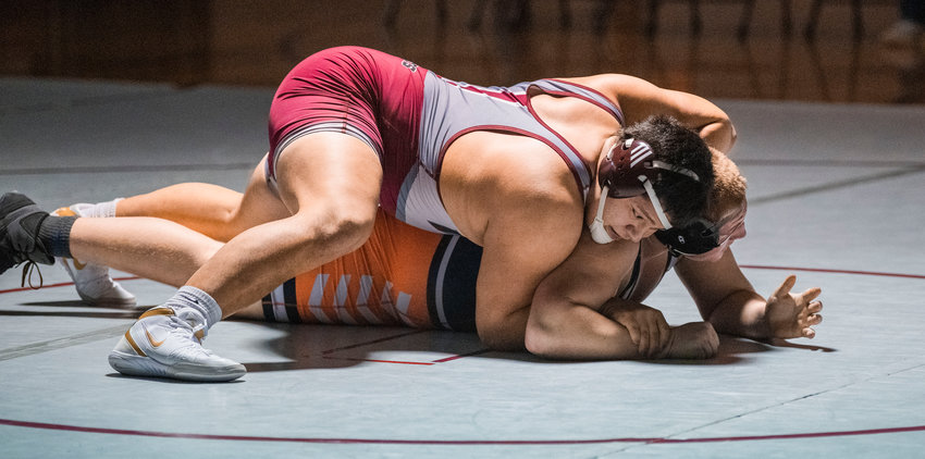 W.F. West senior Daniel Matagi defeats his opponent Centralia senior Willy Stinkoway Thursday night in Chehalis.