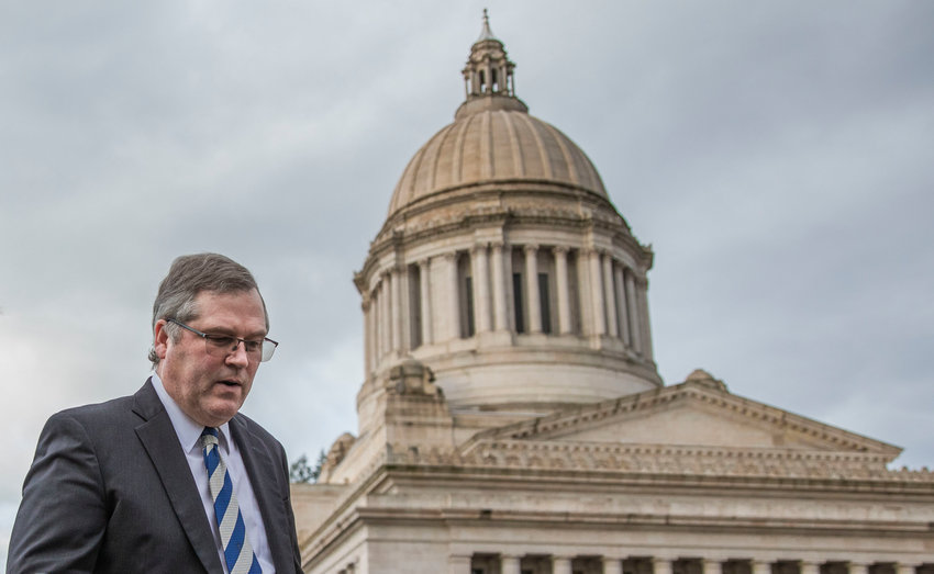 State Rep. J.T. Wilcox, R-Yelm, walks outside the Washington State Capitol Building in Olympia in 2023.