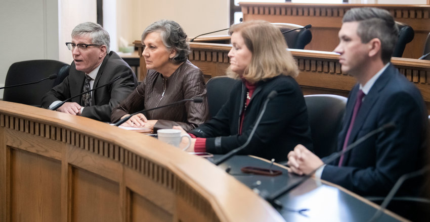 From left, Timm Ormsby, Lynda Wilson, Christine Rolfes and Drew Stokesbary talk to members of the press about budgets on Thursday inside the John A. Cherberg Building in Olympia.