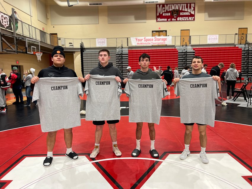 Daniel Matagi, Andrew Penland, Cristo Parriott, and Blake Ely pose for a photo after winning their respective weight classes at the MHS Your Space Storage Invite in McMinnville, Ore., on Jan. 7.