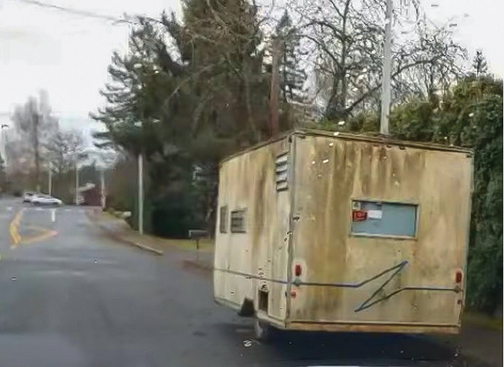 Trailers and tarped vehicles, a number of which lack registration tags, sit on Battle Ground streets, as seen by city mayor Philip Johnson during a recent drive through town.