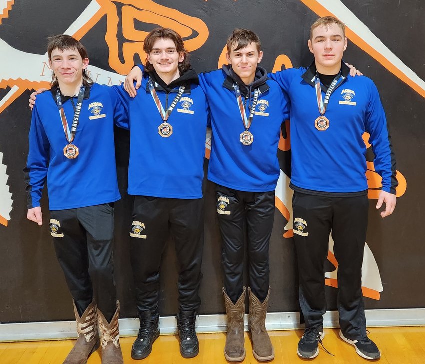 Adna wrestlers who placed at the Justin Norton Memorial Tournament in Rainier pose for a photo, including Kooper Moon, Cohen Hartley, Sean Hellem, and Ryder Calhoun.