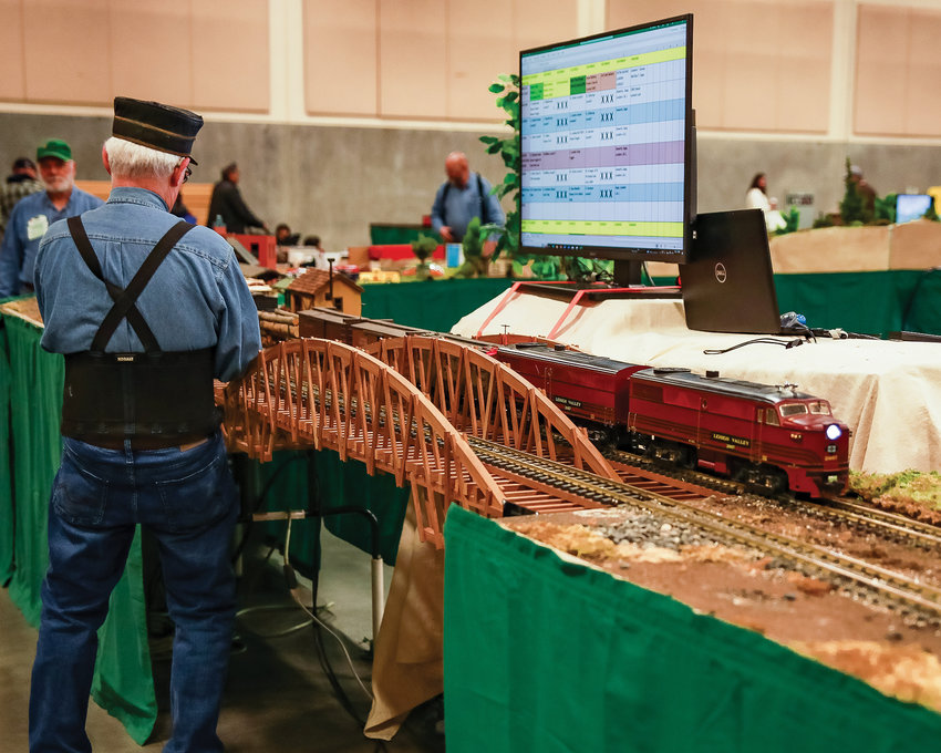 A G scale model train makes a pass by a hobbyist for The Rose City Garden Railroad at the Clark County Event Center on Saturday, Jan. 14.