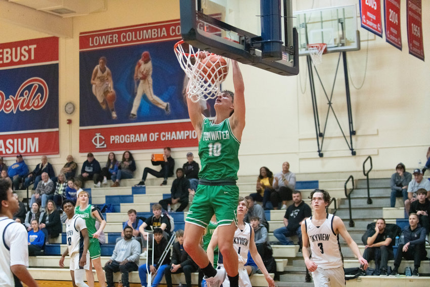 Andrew Collins slams home a transition dunk during the second quarter of Tumwater's 63-61 win over Skyview on Jan. 16 at LCC's MLK Day Classic in Longview.