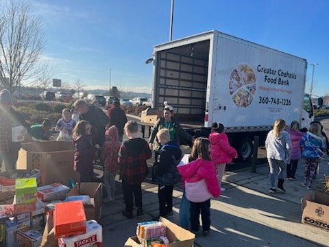 Elementary students in the Chehalis School District scored big in their annual food drive, gathering over 8,000 pounds of food.